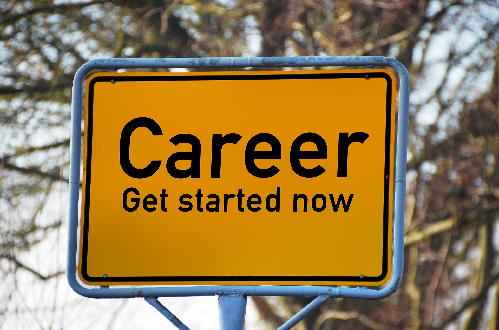 A yellow road sign containing the text "Career Get started now".