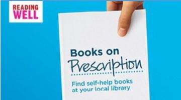 Blue background with 'Reading Well' banner in top left corner. Hand holding book displaying text 'Books on Prescription. Find self-help books at your local library.'