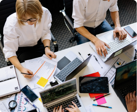 photo looking down on team working on a paper
